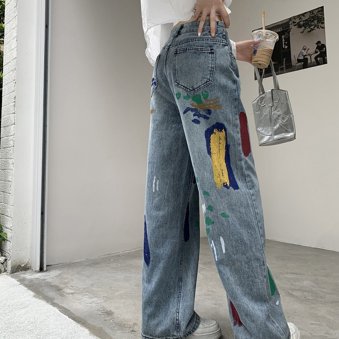 Graffiti spray paint ripped jeans