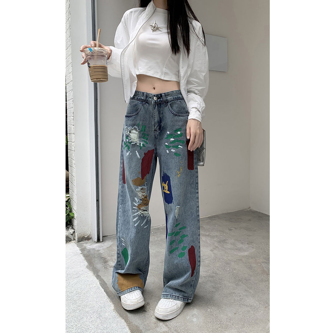 Graffiti spray paint ripped jeans