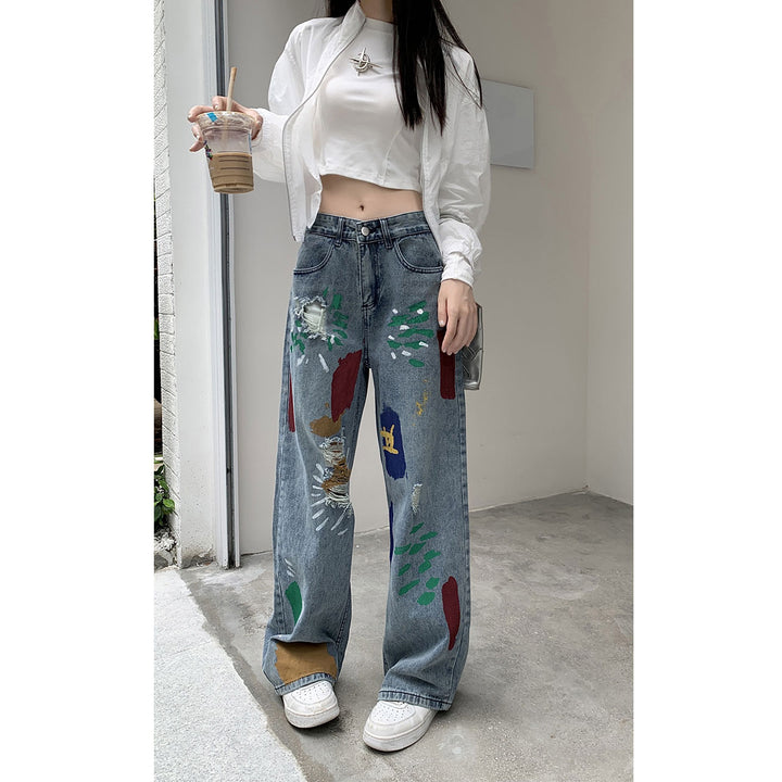Graffiti spray paint ripped jeans